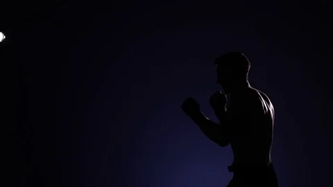 Boxer training in a gym, dramatic lighting Stock Footage 75827922