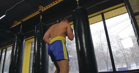 Boxer training punching bag 4k video. Fighter fulfills jab cross punch series Stock Footage 70400982