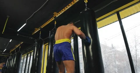 Boxer training punching bag 4k video. Fighter fulfills jab cross punch series Stock Footage 70401689