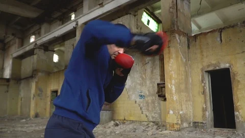 A boxer trains in an abandoned building. Stock Footage 89752157