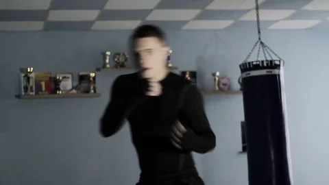 Boxer trains blows in the training hall Stock Footage 82747157