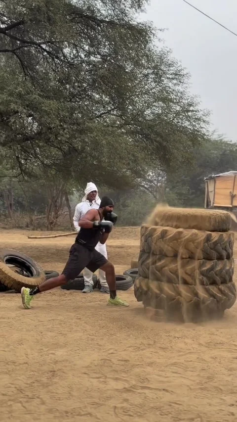 Boxer Trains On Heavy Stack of Tires, Haryana, India - 01 Jul 2026 Stock Footage 346729014