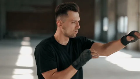 Boxer Warms up through Punching Stockbeeldmateriaal 91793570