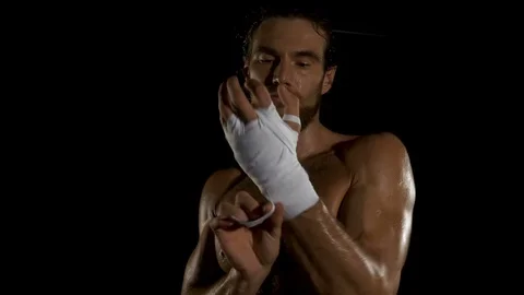Boxer is wrapping hands with boxing wraps 스톡 동영상 85854968