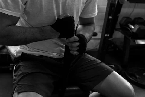 Boxer wrapping hands preparing for training session Stock Photos
