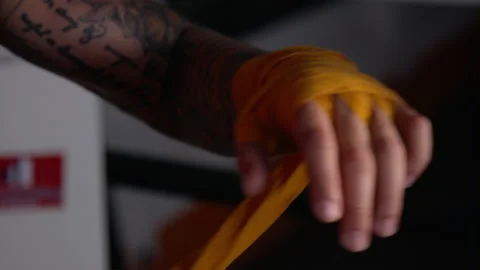 Boxer wrapping his left hand Stock Footage 165449475