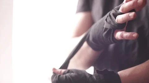 Boxers hand with black boxing wraps. The fighters fists before sparring or Vídeo Stock 333777945