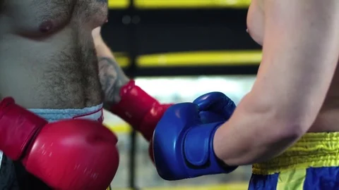 Boxers hands starts fight touch gloves each other HD slow motion video Stock Footage 70385428