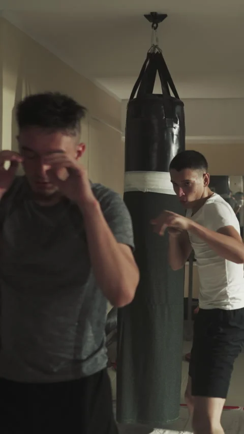 Boxers repeat punching motion following coach Stock Footage 317395805