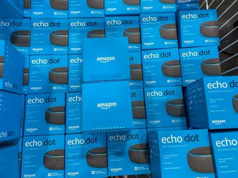 Boxes of Amazon Echo Dot virtural assistants for sale in a display bin in a B Stock Photos