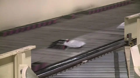 BOXES AND PACKAGES BEING SORTED ON CONVEYOR BELT SHIPPING HUB Stock Footage 335207050