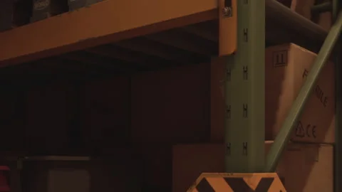 Boxes and storage area seen in a warehouse during evening light Stock Footage 343498669