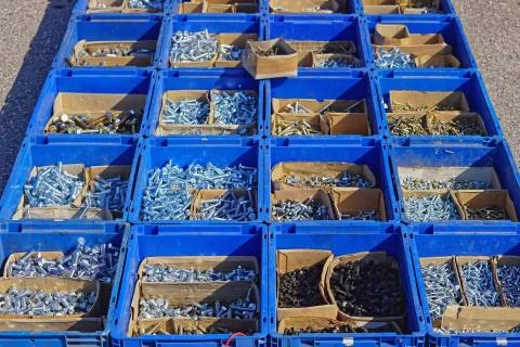 Boxes of bolts Stock Photos