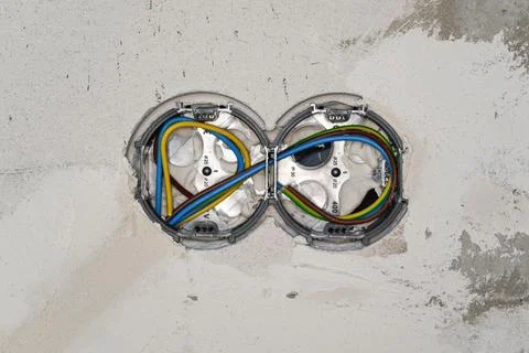 Boxes with cables for electric sockets installed in new house building empt.. Foto stock