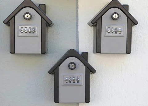 Boxes containing the keys for the short-term rental apartments with the sec.. Fotos Stock