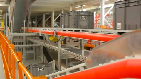 Boxes on the conveyor. Conveyor of the logistics center. Stock Footage