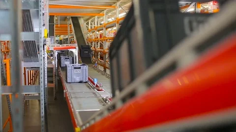 Boxes on the conveyor. Conveyor of the logistics center. Stock Footage 77277332