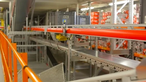 Boxes on the conveyor. Conveyor of the logistics center. Stock Footage 77277341
