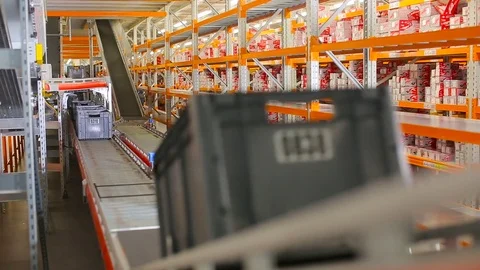 Boxes on the conveyor. Conveyor of the logistics center. Stock Footage 77277386