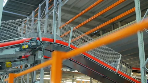 Boxes on the conveyor. Conveyor of the logistics center. Stock Footage 90460652