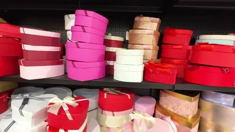 Boxes of different colors on a shelf in a gift shop. Stock Footage 255619740