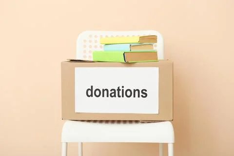 Boxes with donations with the necessary things on the table Stock-Fotos