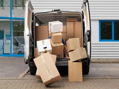 Boxes falling from back of van 스톡 사진