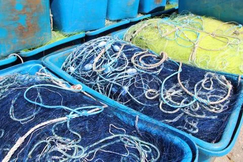 Boxes with fishing net Stock Photos