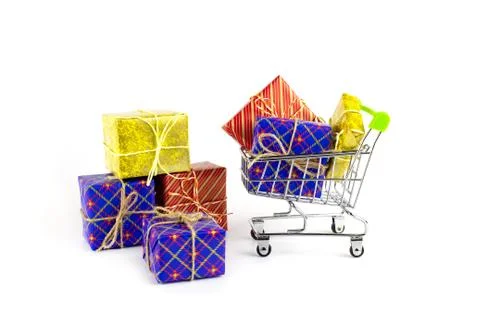 Boxes with gifts in bright packaging and shopping cart, preparation for the h Stock Photos