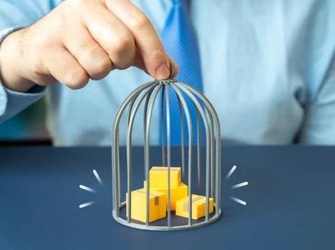 Boxes of goods under a cage. Delays during customs clearance quarantines an.. Stock Photos