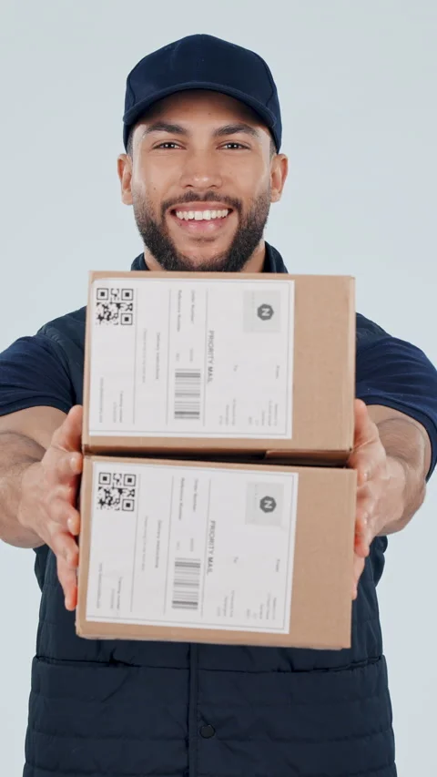 Boxes, happy and face of delivery man in studio with confidence for distribution Stock Footage 336839983