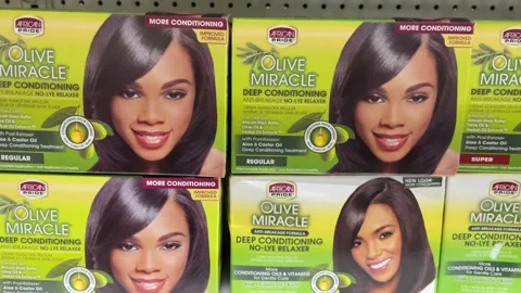 Boxes of at-home African Pride Olive Miracle relaxers for Black hair Stock-Footage 256282784