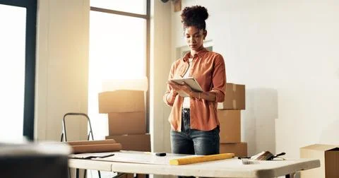 Boxes, interior design and tablet with woman in new home for diy project or.. Foto stock