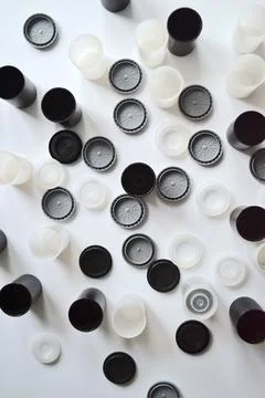 Boxes with lids from rolls of 35mm negative film on white background. Film .. Stock Photos