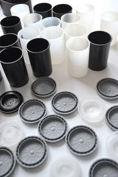 Boxes with lids from rolls of 35mm negative film on white background. Stock Photos