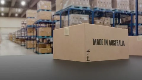 Boxes with MADE IN AUSTRALIA text on conveyor. Australian goods related loopable 動画素材 176463742