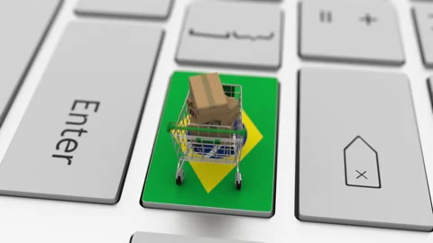Boxes with MADE IN BRAZIL text and shopping cart on the keyboard. Conceptual Stock Footage 146371831