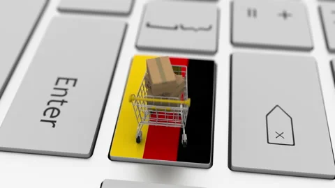 Boxes with MADE IN GERMANY text and shopping cart on the keyboard. Conceptual Stock Footage 146688633