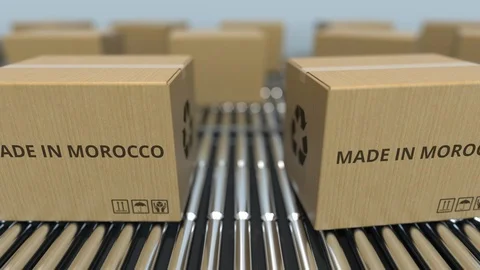 Boxes with MADE IN MOROCCO text on roller conveyor. Moroccan goods related Video stock 109045037