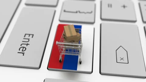 Boxes with MADE IN RUSSIA text and shopping cart on the keyboard. Conceptual Stock Footage 146460297