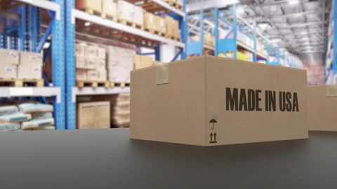 Boxes with MADE IN USA text on roller conveyor. American goods related loopable Video stock 159565606