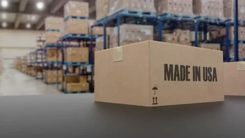Boxes with MADE IN USA text on roller conveyor. American goods related loopable Video stock 173210179