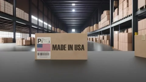 Boxes with MADE IN USA text on roller conveyor. American goods related loopable Video stock 239771139
