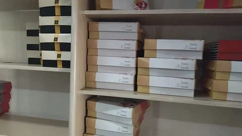 Boxes for packing sweets in a store Stock Footage 303955138