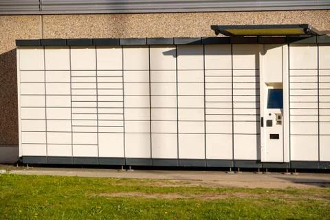 Boxes for parcels and letters on the street, an automatic machine for deliver Stock Photos
