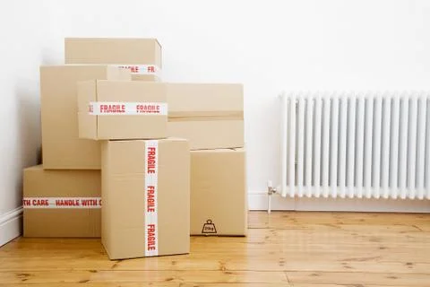 Boxes piling at a corner Stock Photos