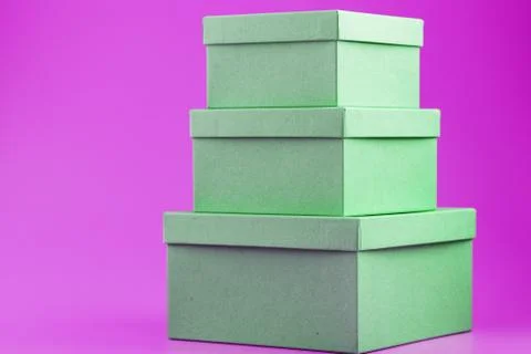 Boxes on a pink background in the form of a pyramid. 写真素材