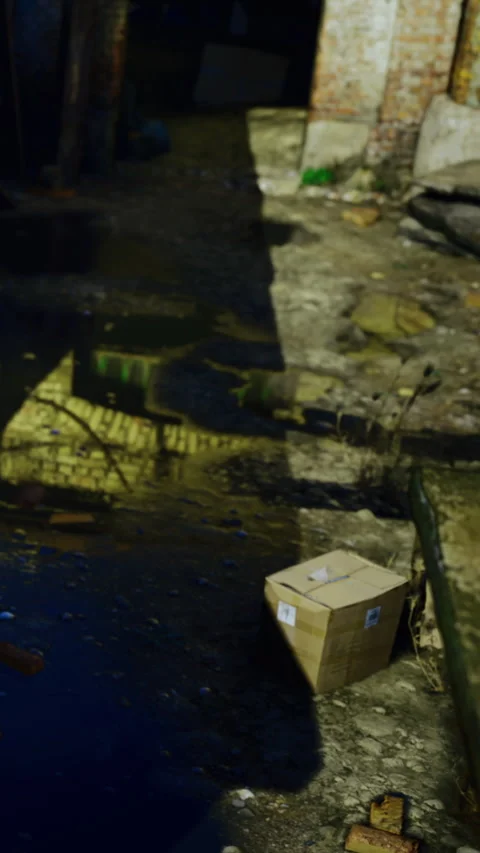 Boxes placed on the ground near the old building in the alleyway at daytime Video stock 334191434