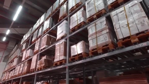 Boxes on the shelf under the numbers. Stock Stock Footage 79189324