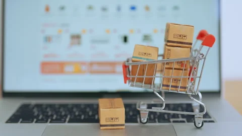 Boxes with shopping cart on a laptop computer. online shopping, Marketplace.. Stock Footage 243717977